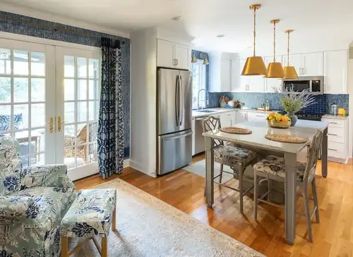 Stratford Hills kitchen in Richmond with blue tile backsplash, brass drum pendants and a dining table by French doors